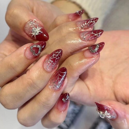 JP3030-Crimson Kiss Almond Press Ons | Spider & Heart Sweet Goth Nails (Reusable Waterproof)​​ ​​Subtitle:​​ Your Dark Valentine Manicure ❤️🕷️ Salon-Grade Edge in 8 Minutes – No Commitment, Maximum Attitude.  (Hero Image: Moody crimson nails with glitter spiders/hearts against crushed velvet, gripping vintage key)