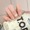 SP168-Silvery Sparkle Magic: Cat Eye French Tips With Hello Kitty Charm - Instantly Glam ✨